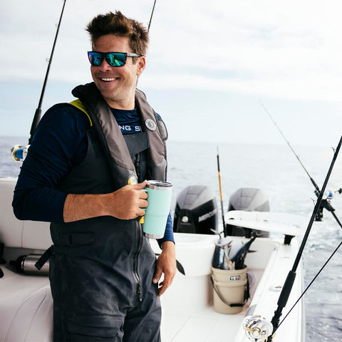 YETI Rambler next to a smartphone for scale demonstrating compact 20 oz size