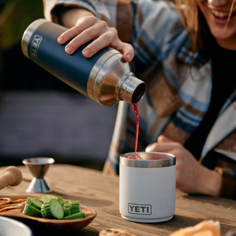 YETI Rambler being shaken by bartender demonstrating secure lid and no-splash benefit