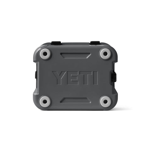 YETI Roadie 24 next to backpack showing size and scale for day-trip planning