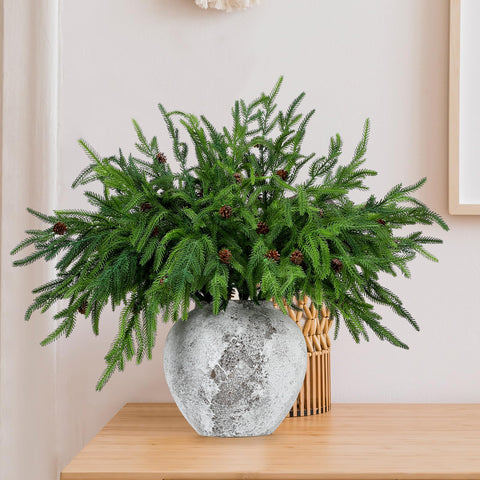 Yinder branches styled as a mantel garland adding festive greenery and durable wear