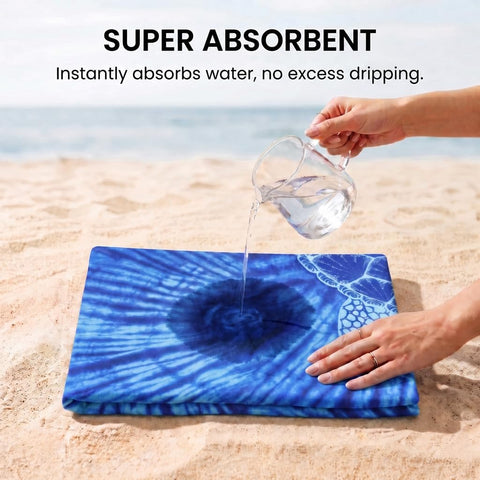 Yongoes towel laid on sand illustrating sand-resistant benefit
