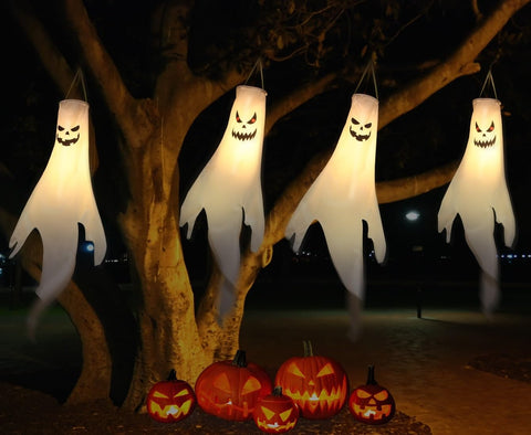 YOTNUS ghosts on porch railing demonstrating layered seasonal decoration impact