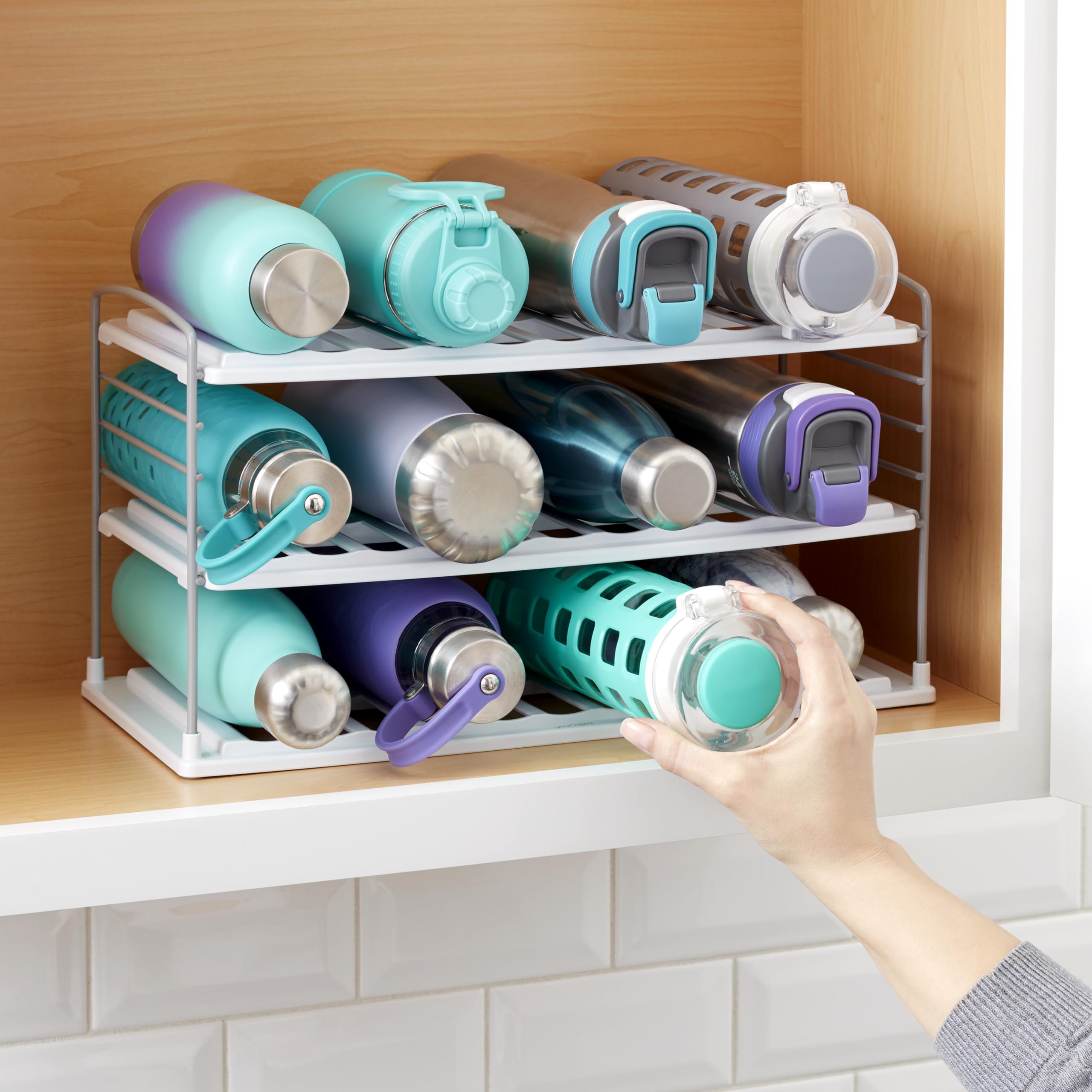 YouCopia UpSpace holding a handled travel mug showing adjustable shelf fit