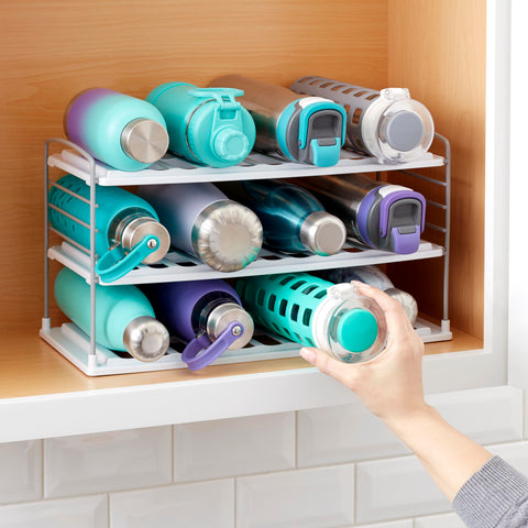 YouCopia UpSpace holding a handled travel mug showing adjustable shelf fit