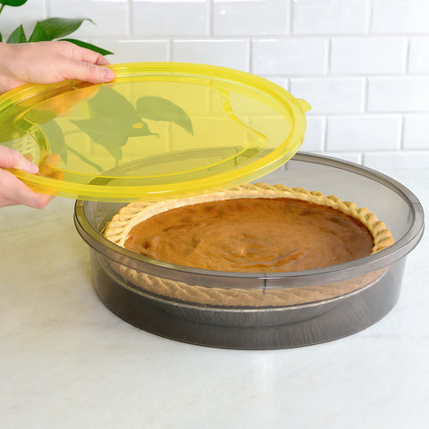 Youngever pie container being carried to a picnic demonstrating portability and secure closure