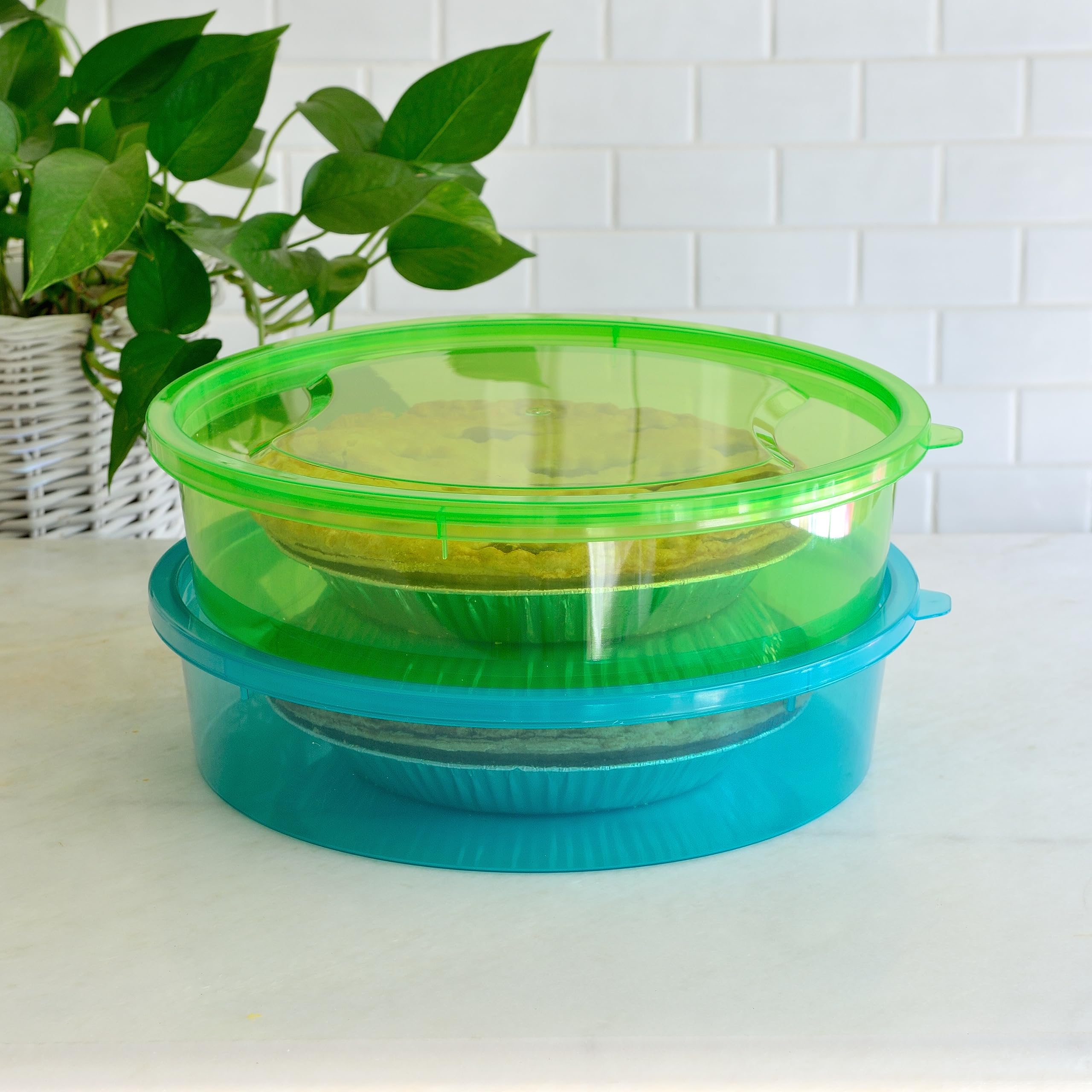 Youngever pie container next to a standard pie tin showing 11-inch size and space-saving benefit