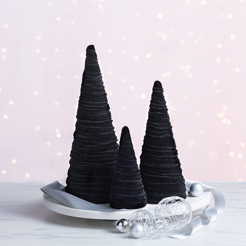 Your Heart's Content trees beside candle to show scale and versatile placement