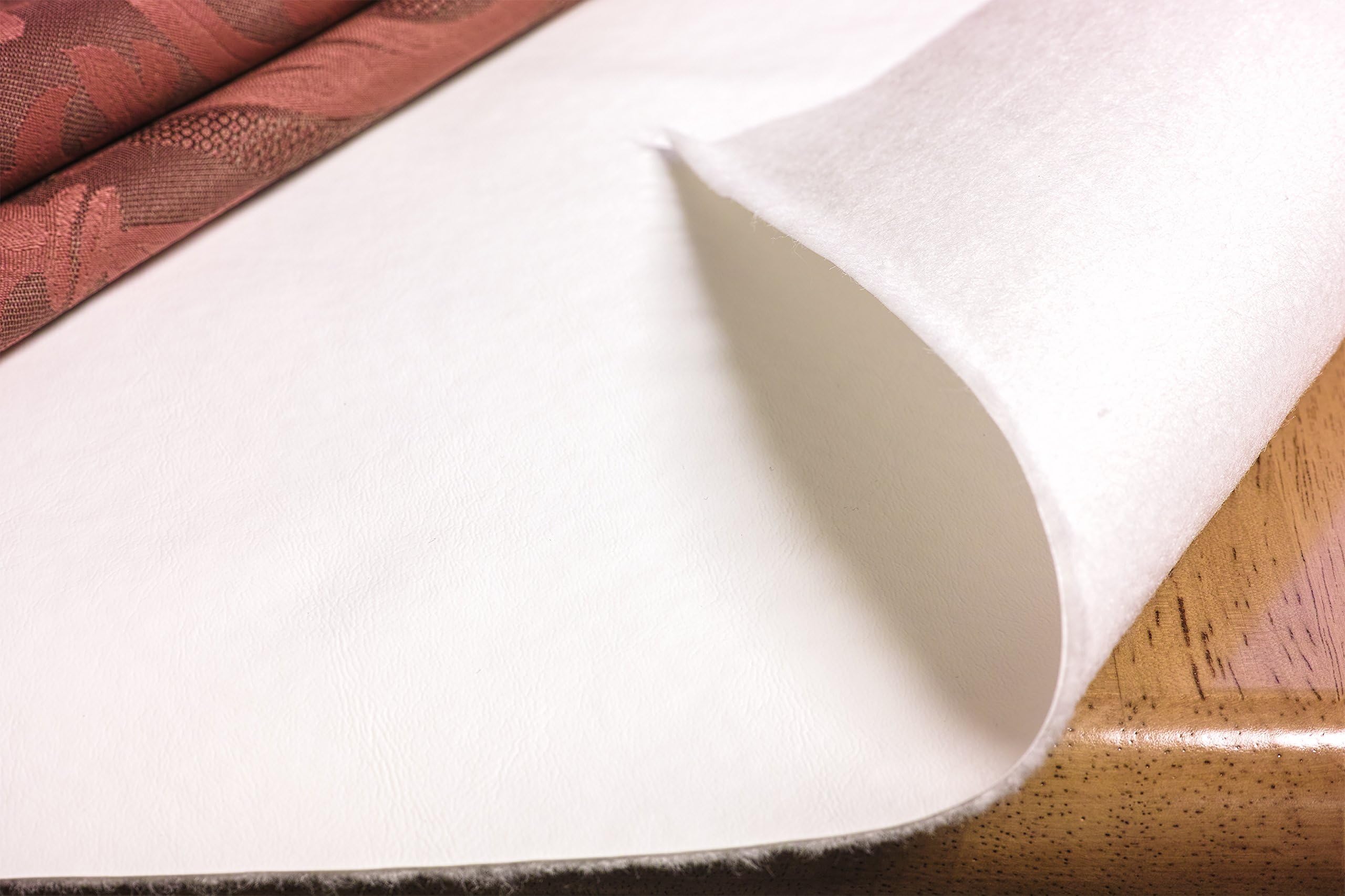 Yourtablecloth front view of 52x140 pad showing white vinyl surface and benefit of spill protection