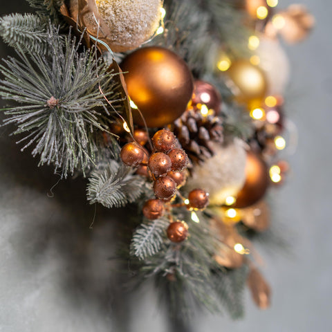 YULETIME wreath used on tabletop vignette adding instant seasonal charm