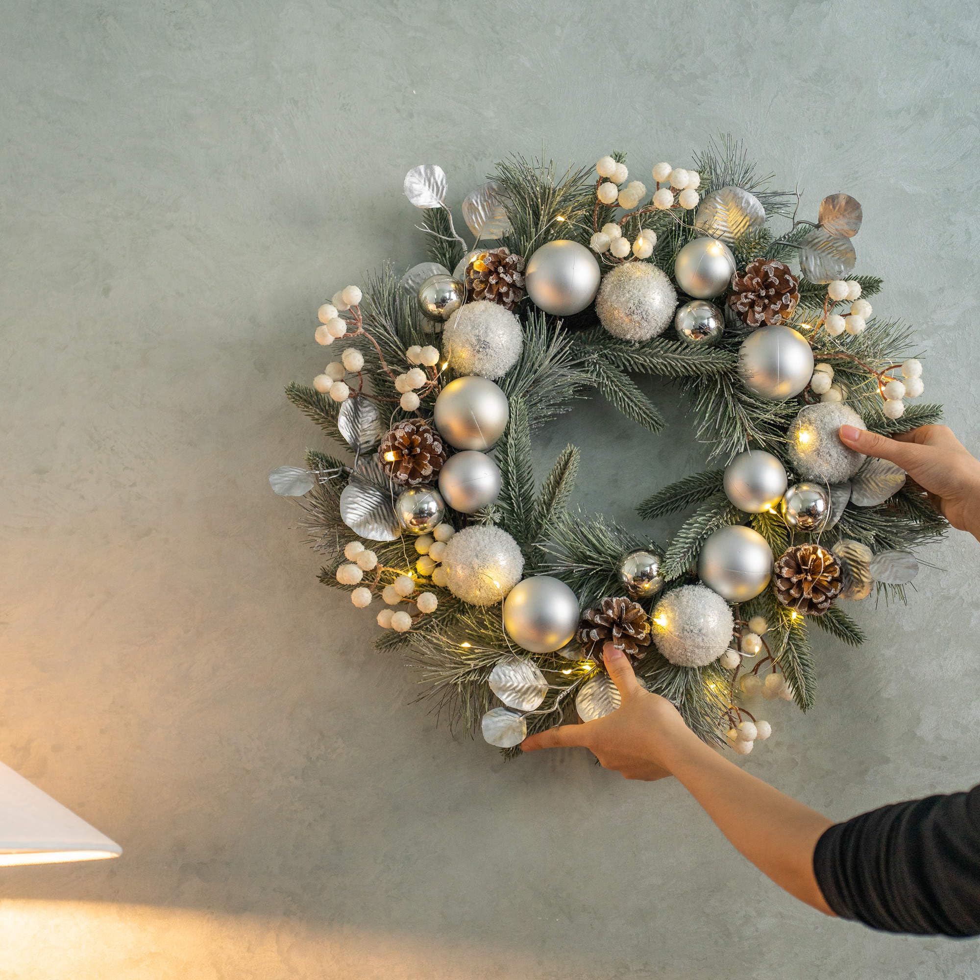 YULETIME wreath hanging on door illustrating correct scale and placement