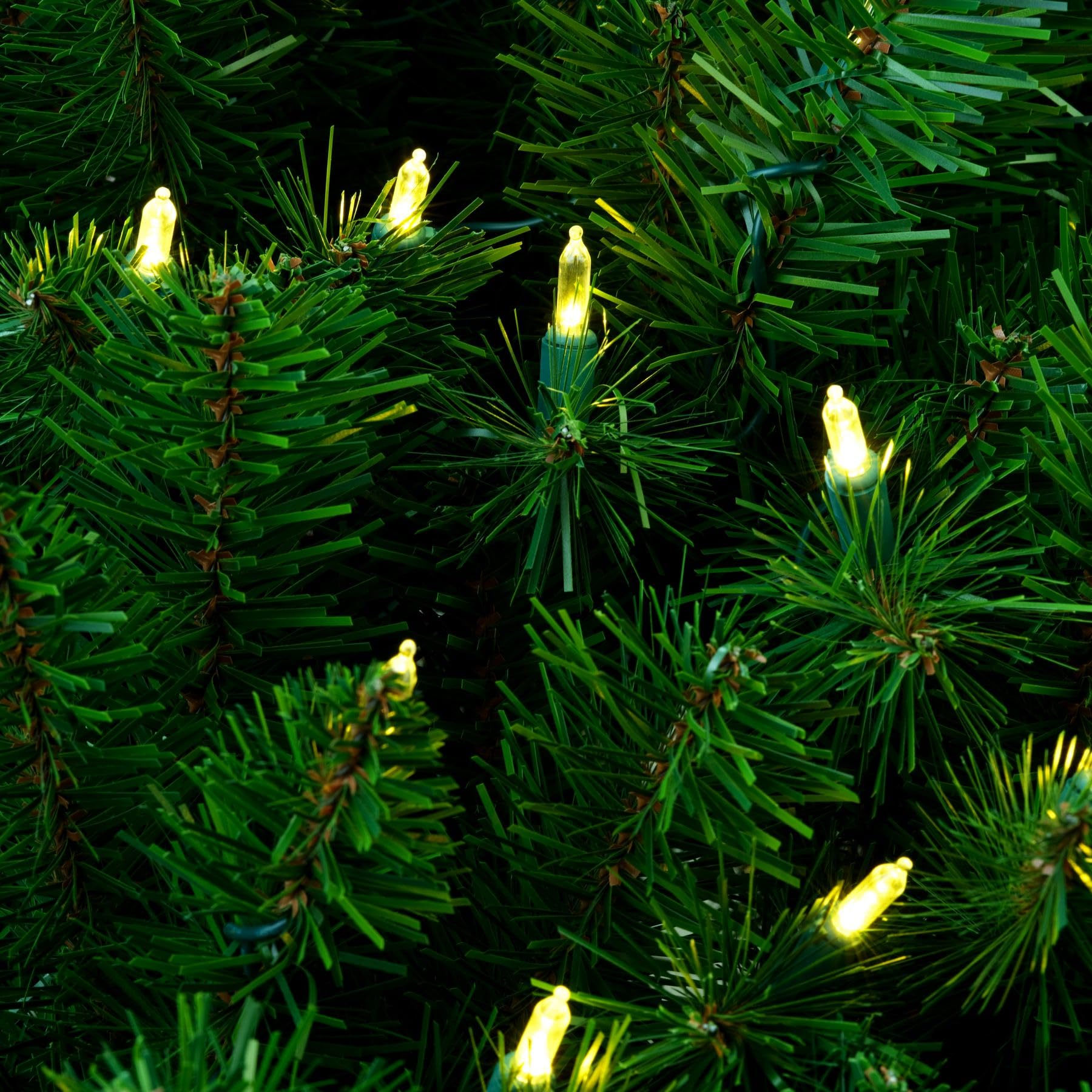 YULETIME warm white LED string closeup showing stay-lit bulbs and safe wiring