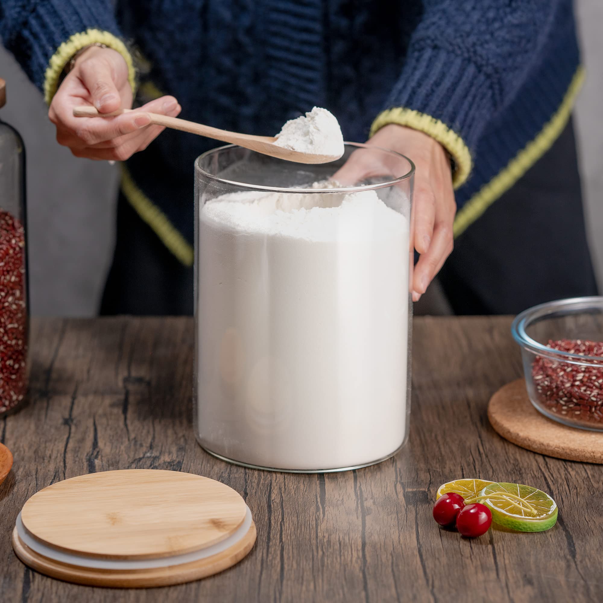 YUNCANG jar next to hand for scale illustrating 108oz capacity and bulk storage benefit