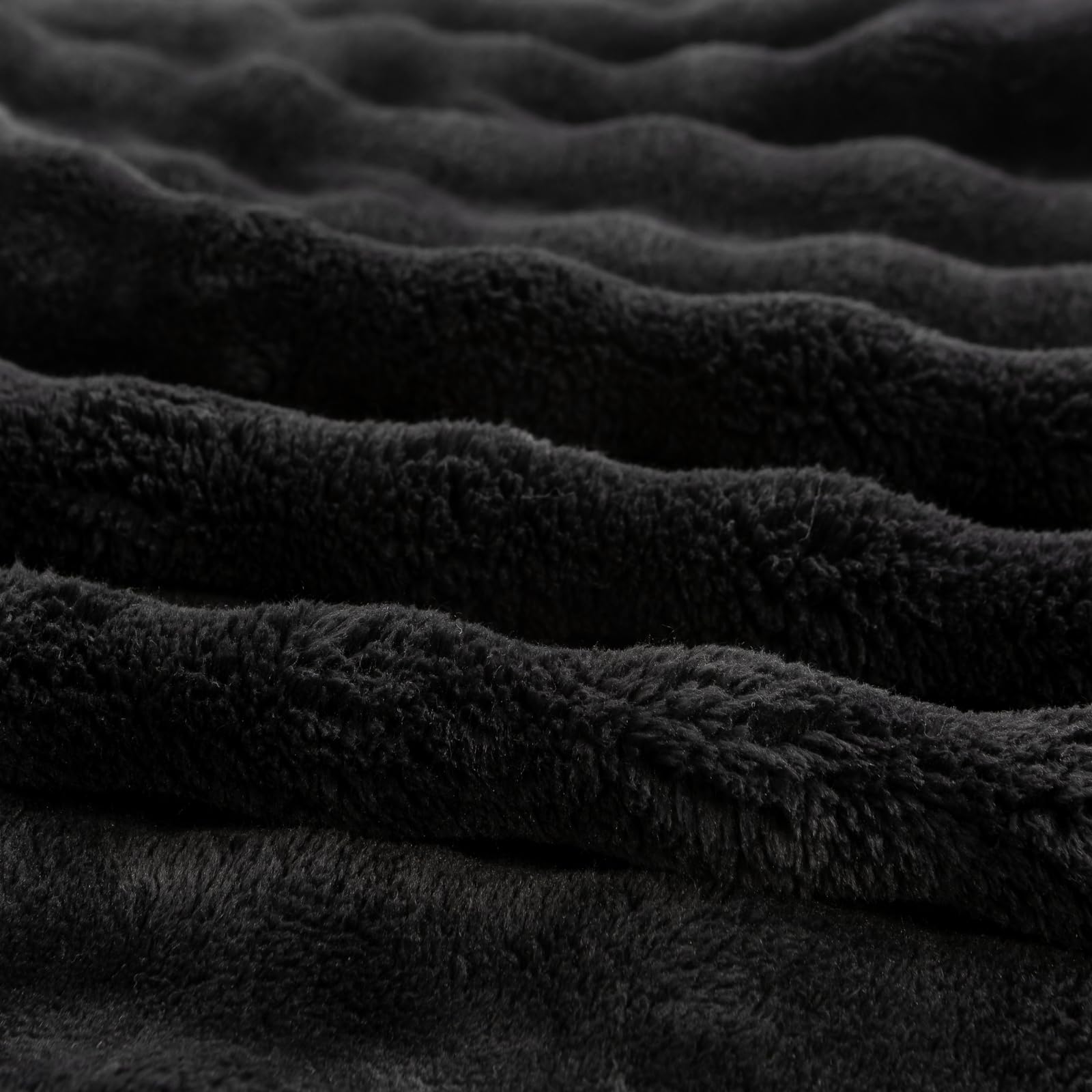 YUSOKI blanket held in hands showing lightweight portability benefit