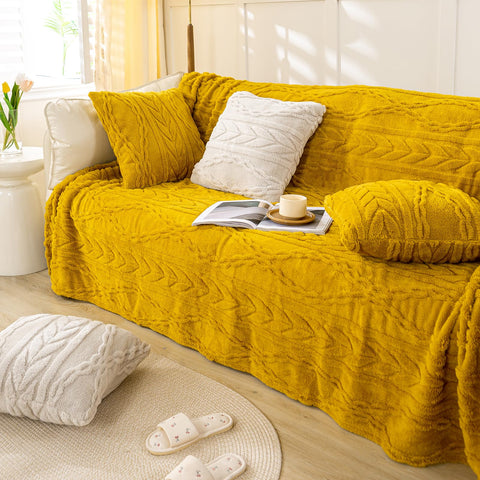 YUSOKI blanket draped on sofa showing warmth and styling benefit