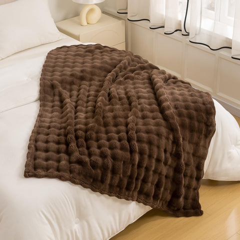 YUSOKI layered on bed to add texture and lightweight warmth to bedroom