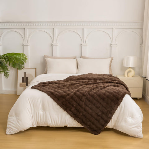 YUSOKI brown throw draped on sofa adding cozy decor and instant warmth