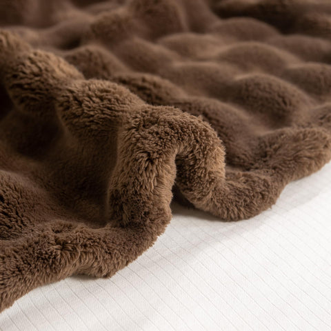 YUSOKI vacuum-packed blanket before fluffing to show compact shipping benefit