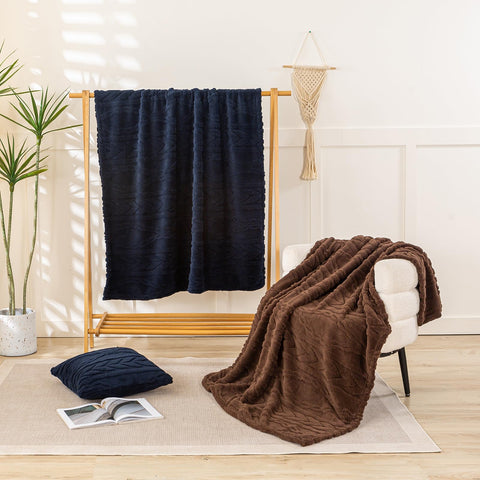 YUSOKI folded on sofa demonstrating throw size and tidy storage benefit