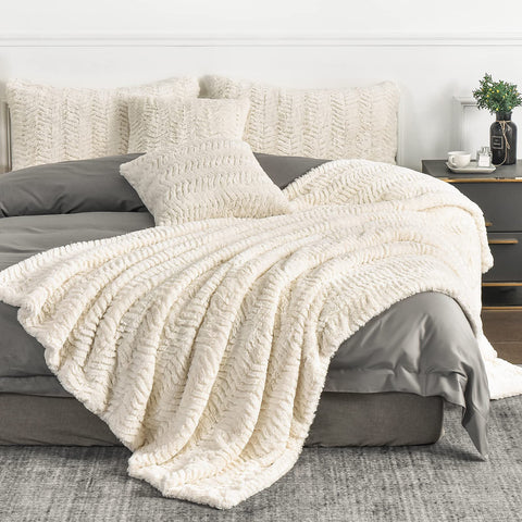 YUSOKI front view of folded ivory blanket showing plush look and inviting warmth