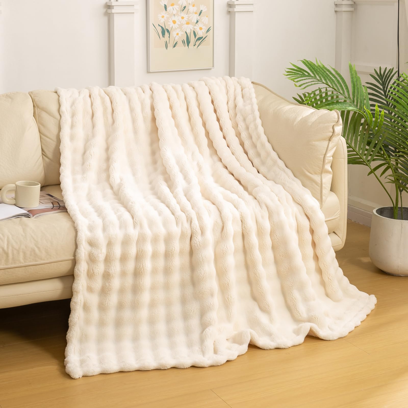 YUSOKI folded ivory throw showcasing neat compact storage and plush appeal