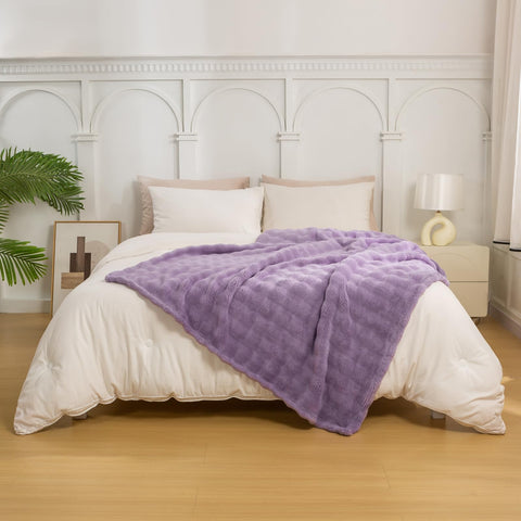 YUSOKI throw draped on sofa showing cozy styling and living room warmth