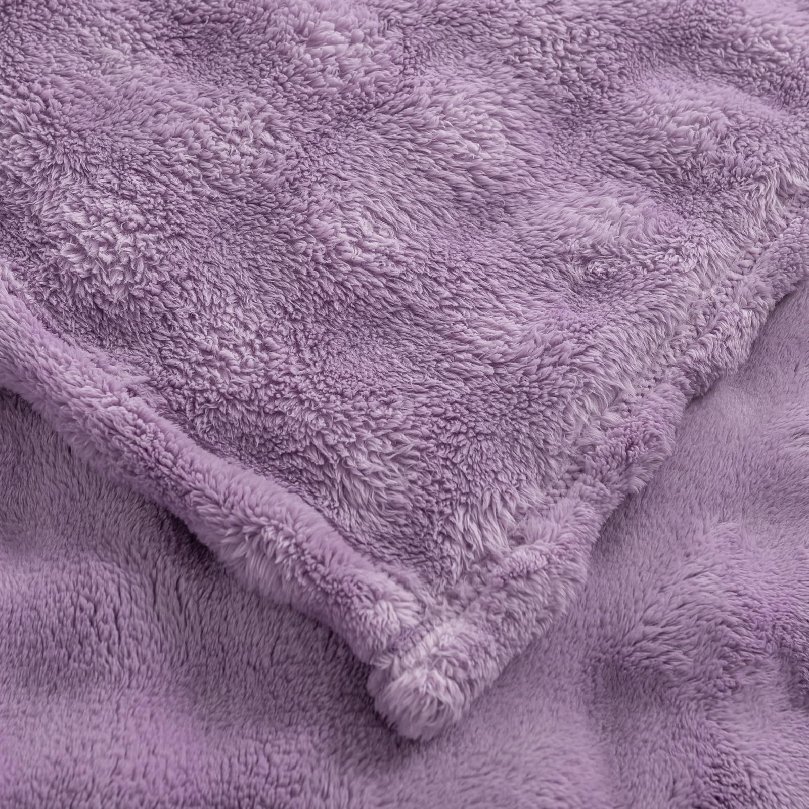 YUSOKI throw beside chair showing 50x60 scale and real-world fit benefit