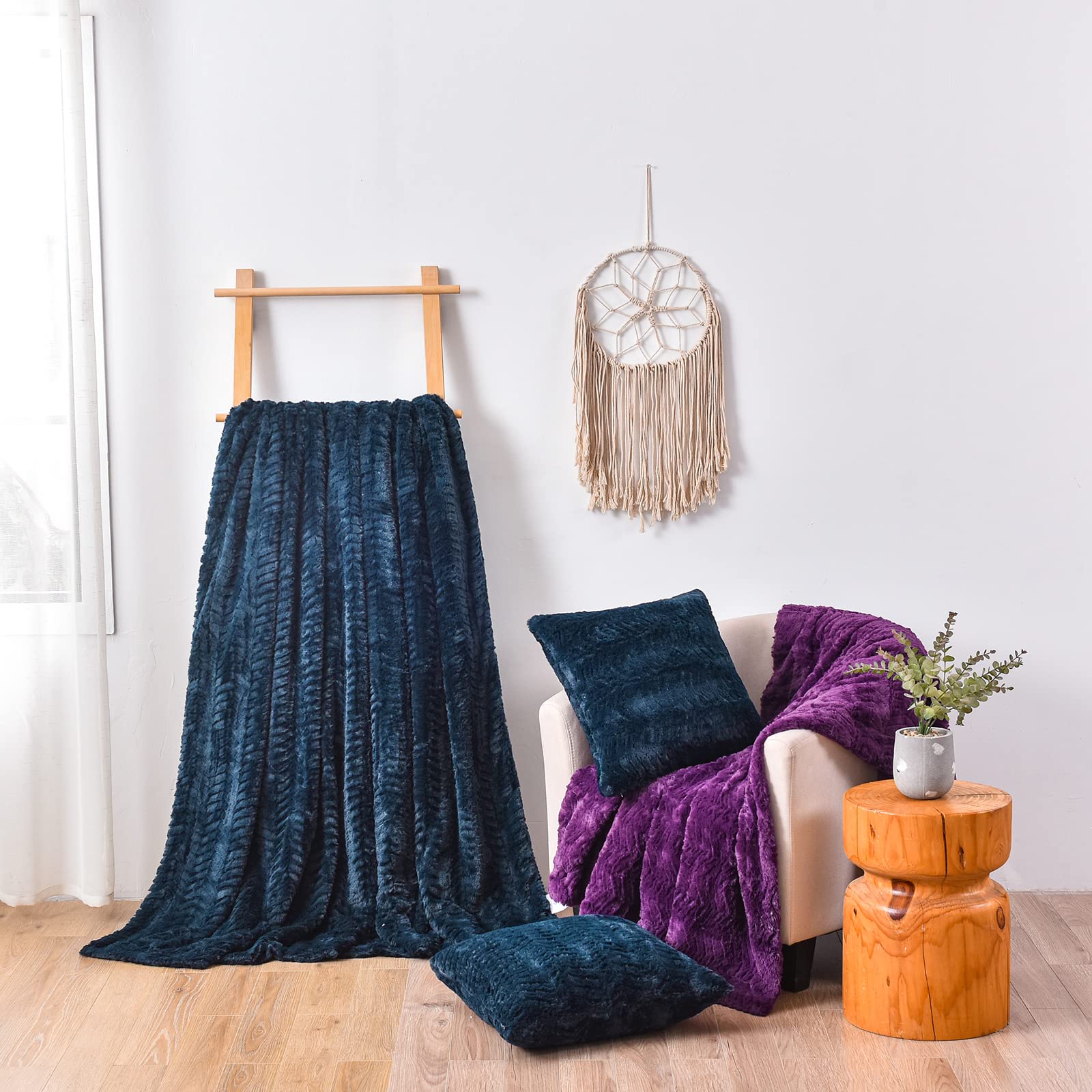 YUSOKI blanket draped on bed showing full coverage and elegant navy tone