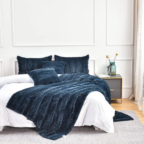 YUSOKI folded throw on sofa highlighting oversized drape and neat styling