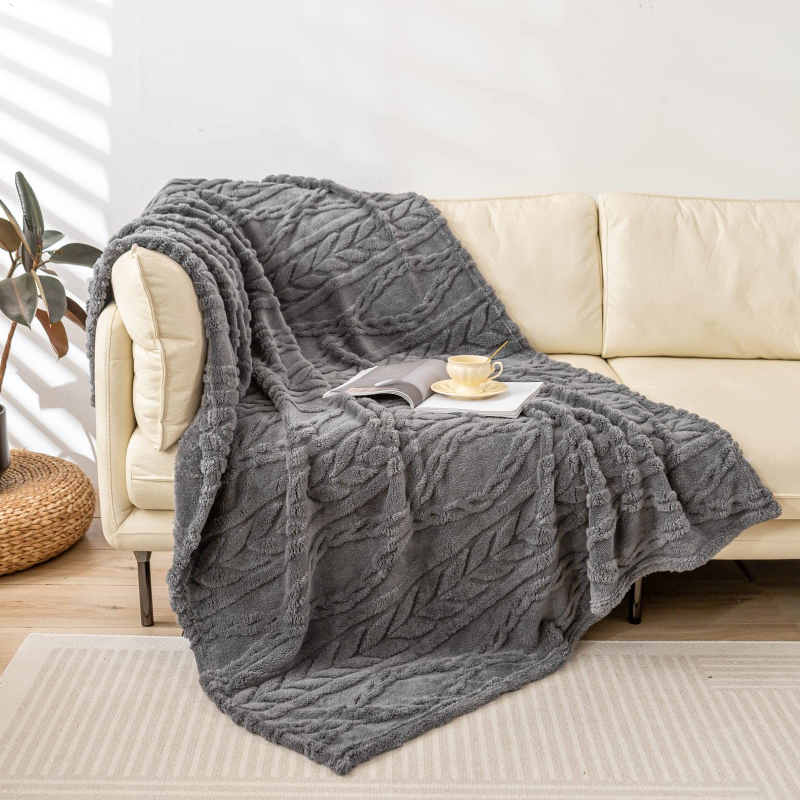 YUSOKI throw front view showing grey boho pattern and cozy look