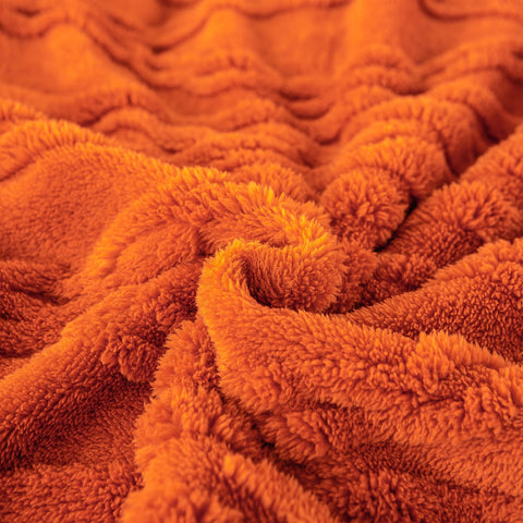 YUSOKI blanket size comparison on couch showing generous coverage