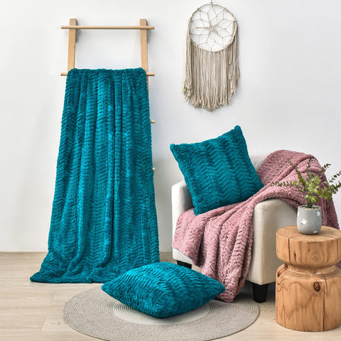 YUSOKI person wrapped in teal throw demonstrating cozy comfort