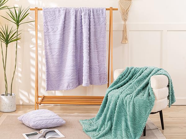 YUSOKI blanket folded on sofa showing drape and everyday convenience