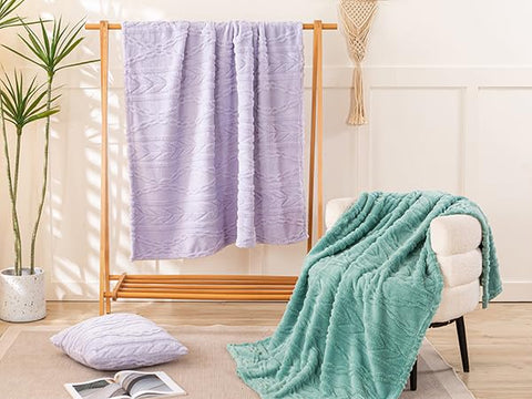 YUSOKI blanket folded on sofa showing drape and everyday convenience