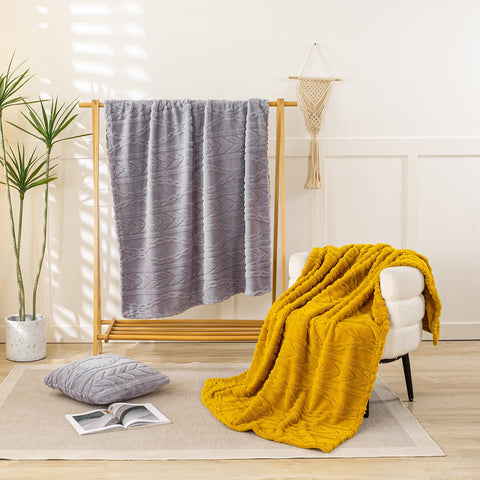 YUSOKI neatly folded throw highlighting compact storage and portability benefit