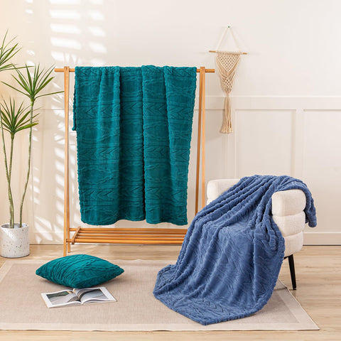 YUSOKI folded throw stacked to show thickness and portability benefit