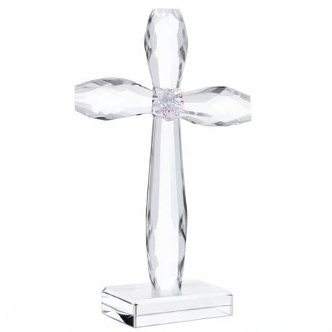 YWHL cross on mantel among decor creating a warm, reflective focal point