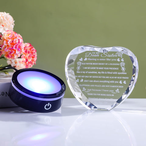 YWHL engraving detail showing laser-etched message preserved inside crystal