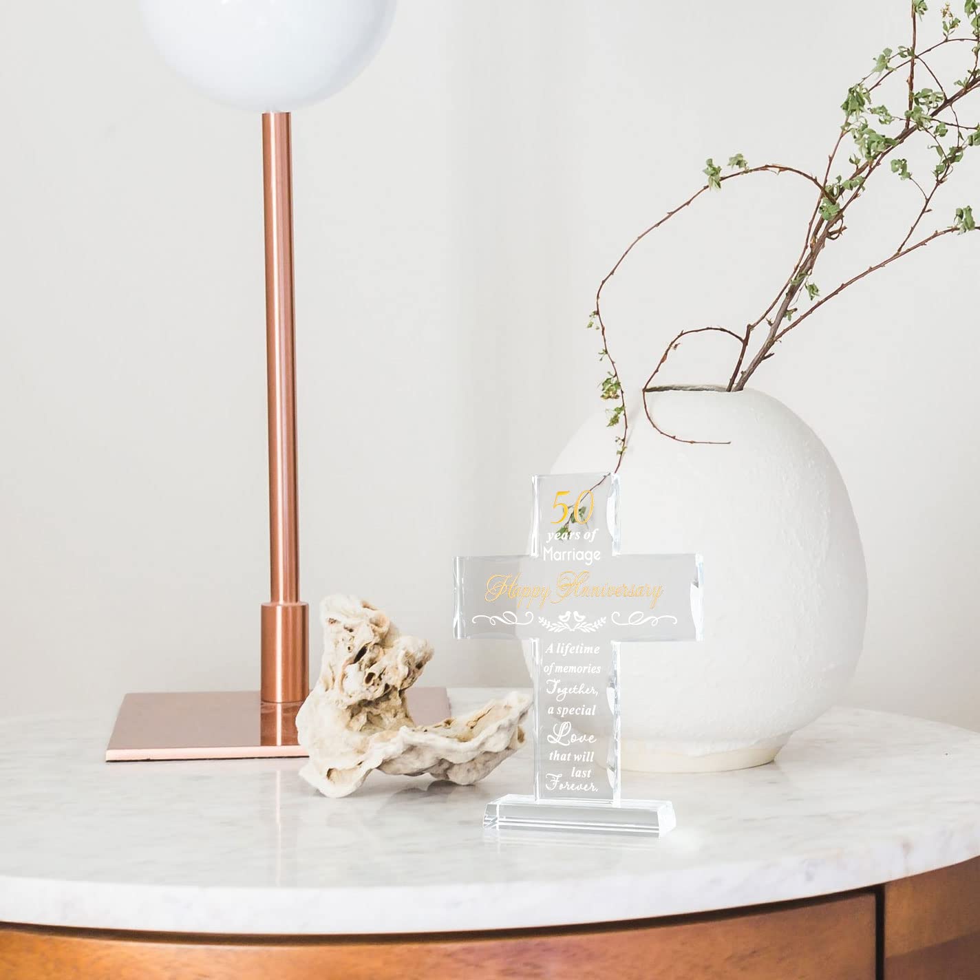 YWHL lifestyle anniversary setting with couple and cross as commemorative centerpiece