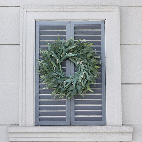YXZZWL wreath styled with bow for seasonal decorating versatility