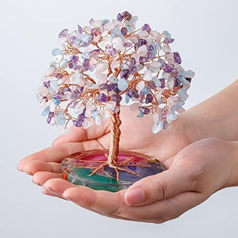 ZenBless tree next to book for scale showing compact size and shelf-ready benefit