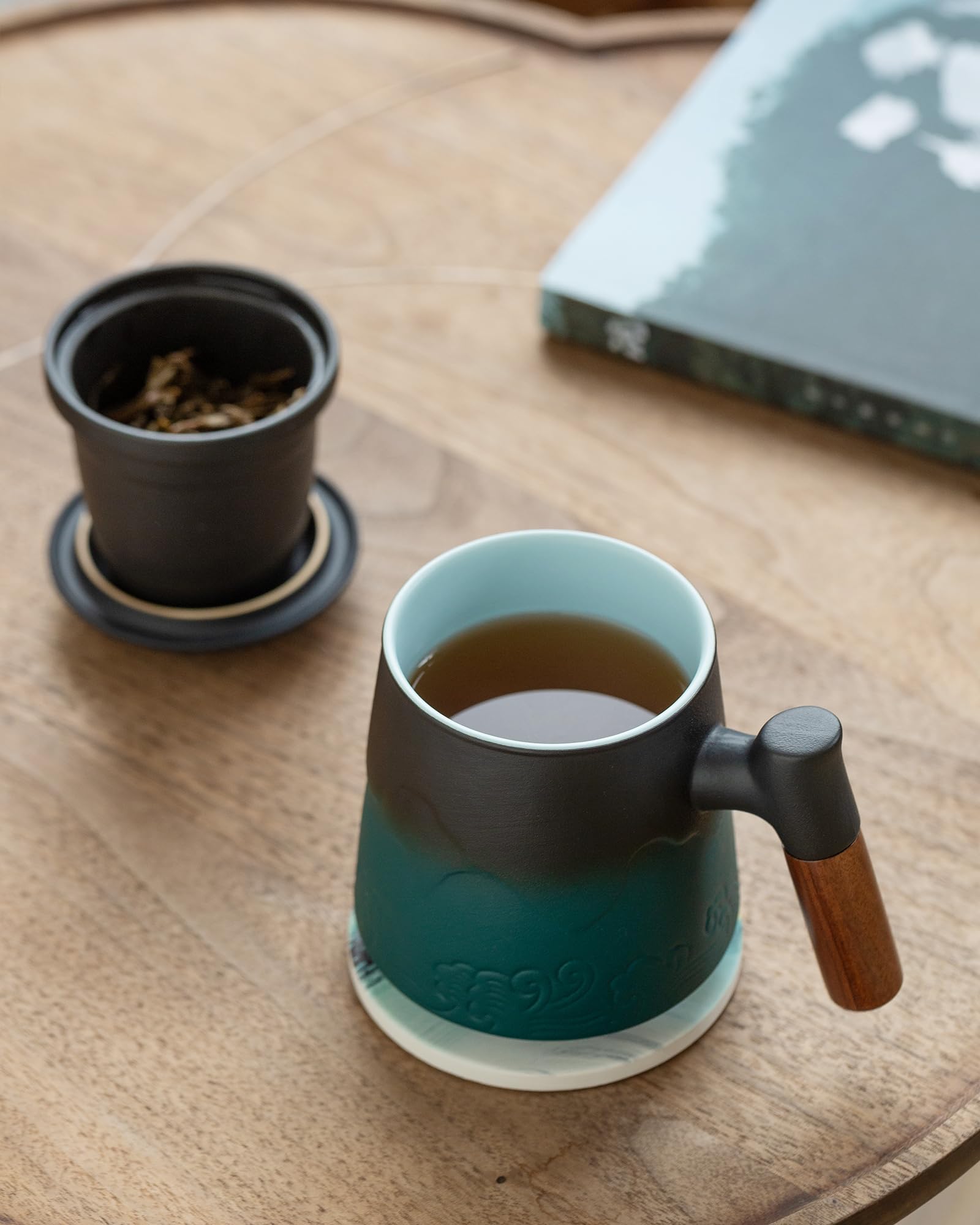 ZENS mug beside a book to show 15oz scale and ideal solo-serve size