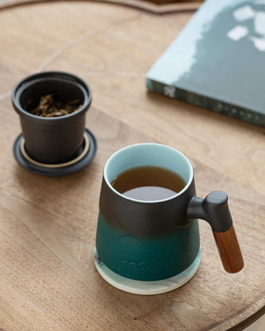 ZENS mug beside a book to show 15oz scale and ideal solo-serve size