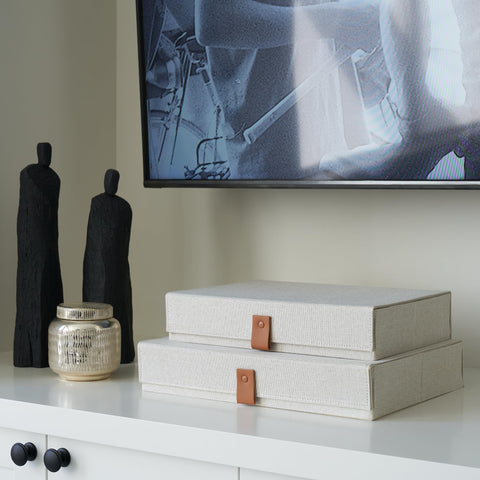 ZICOTO box next to photo sheets showing scale and capacity for standard prints
