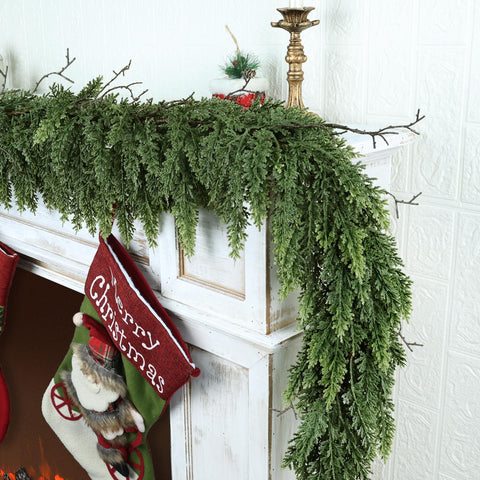 Zmtyykh garland styled on mantel with lights showing warm holiday ambiance