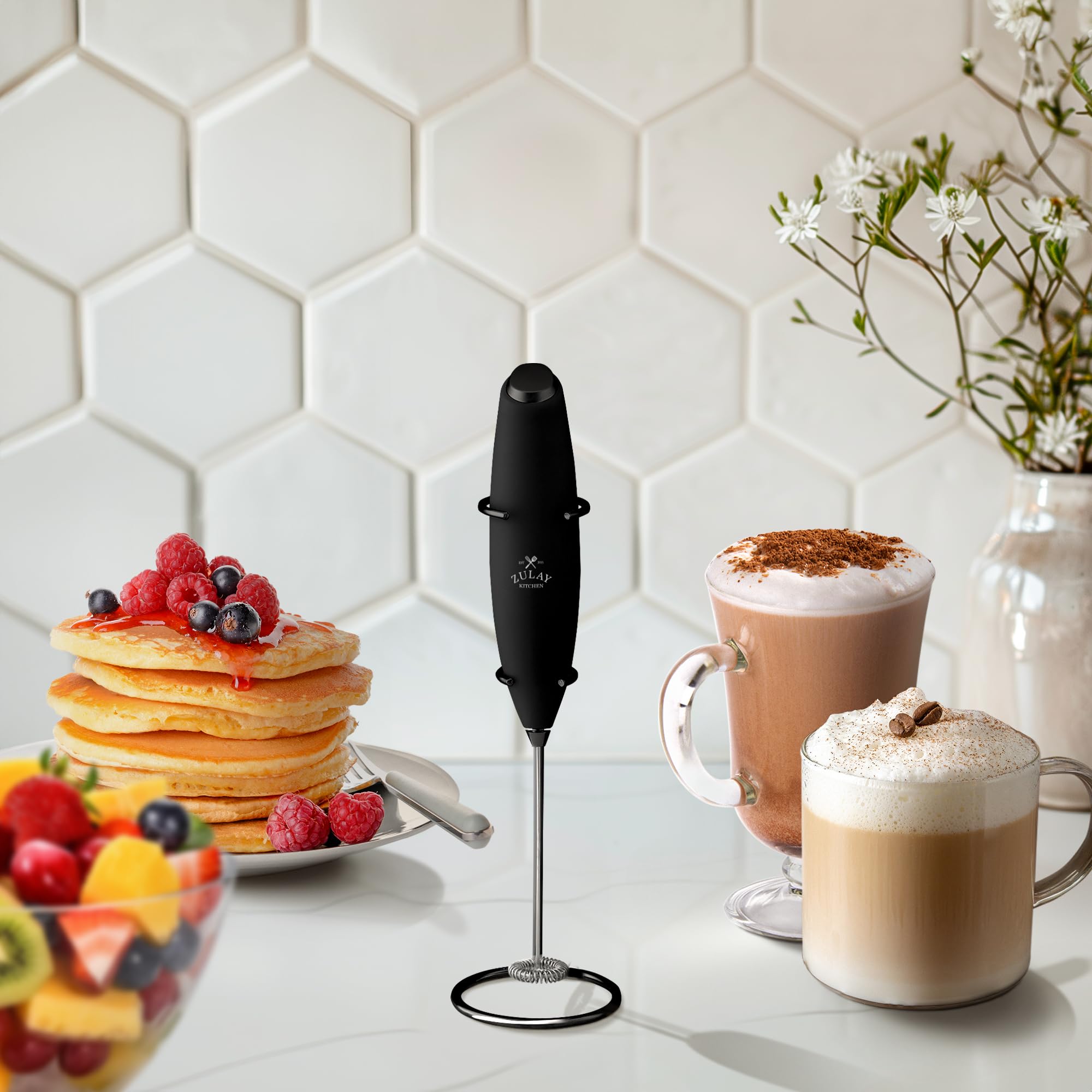 Zulay Kitchen frother standing on included metal stand on kitchen counter, organized storage