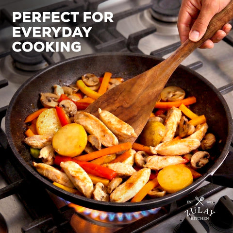 Zulay Kitchen ladle pouring soup showing ergonomic use and spill control benefit