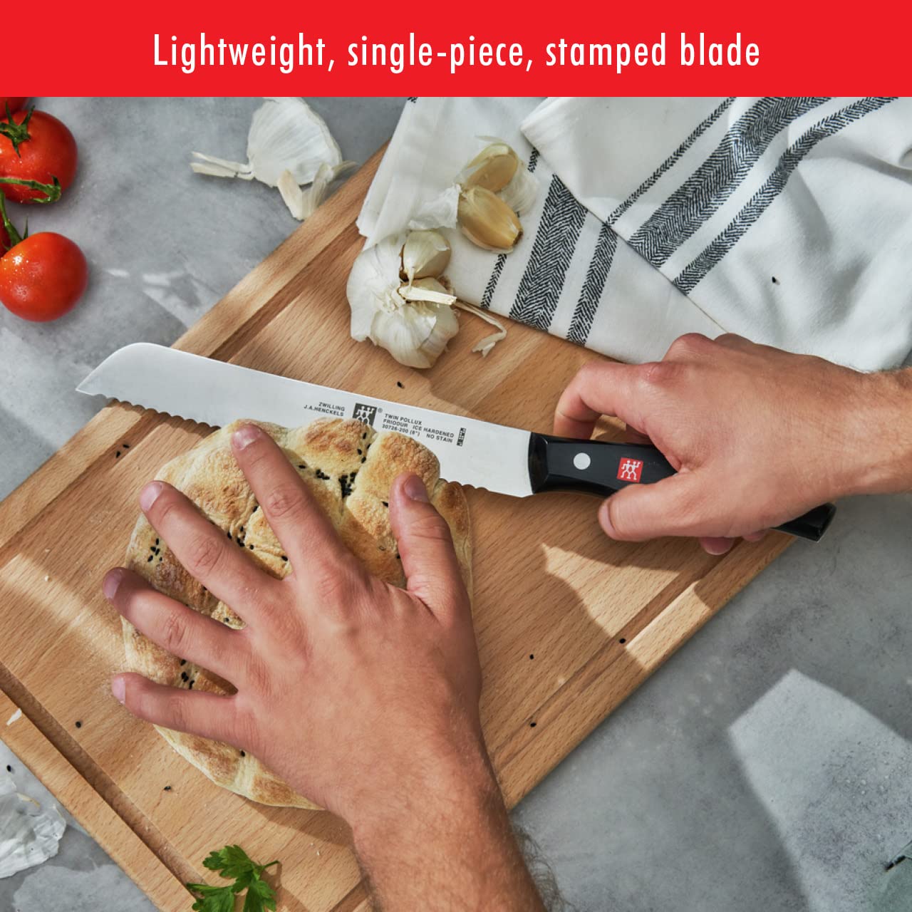 ZWILLING knife in kitchen slicing bread demonstrating precise, effortless cuts