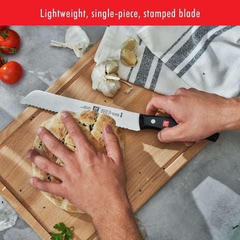 ZWILLING knife in kitchen slicing bread demonstrating precise, effortless cuts