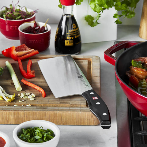 ZWILLING cleaver in kitchen stirring vegetables conveying quick stir-fry prep