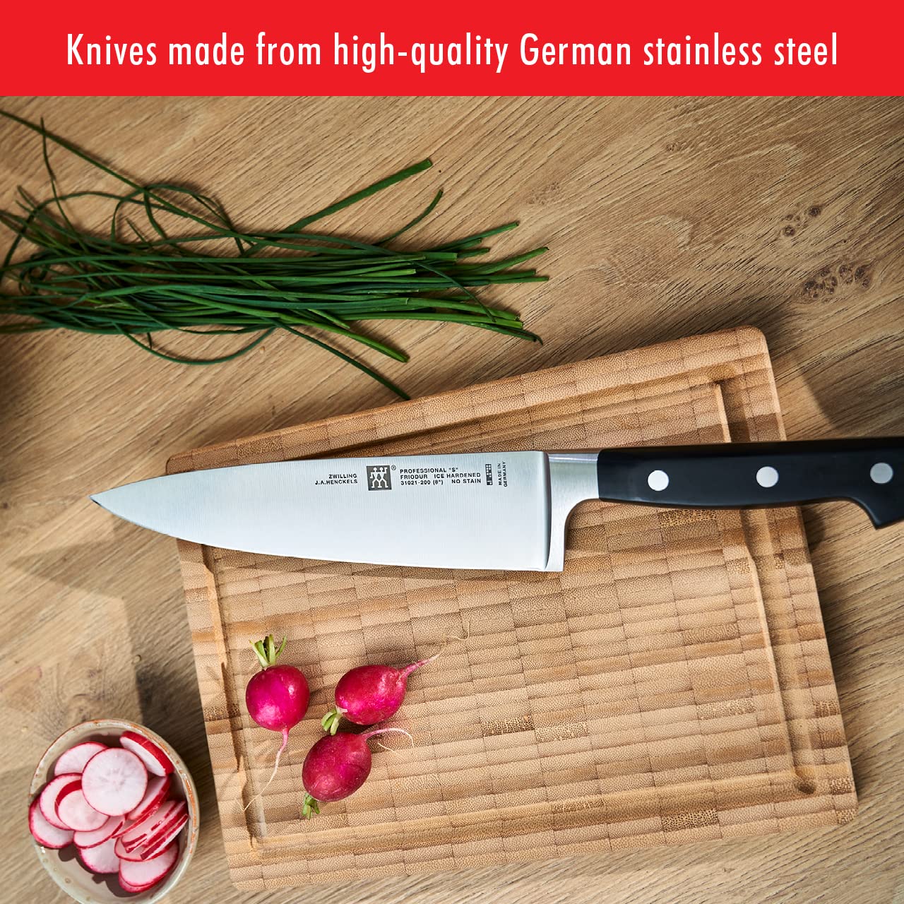 ZWILLING knife in use chopping vegetables illustrating efficient prep benefit